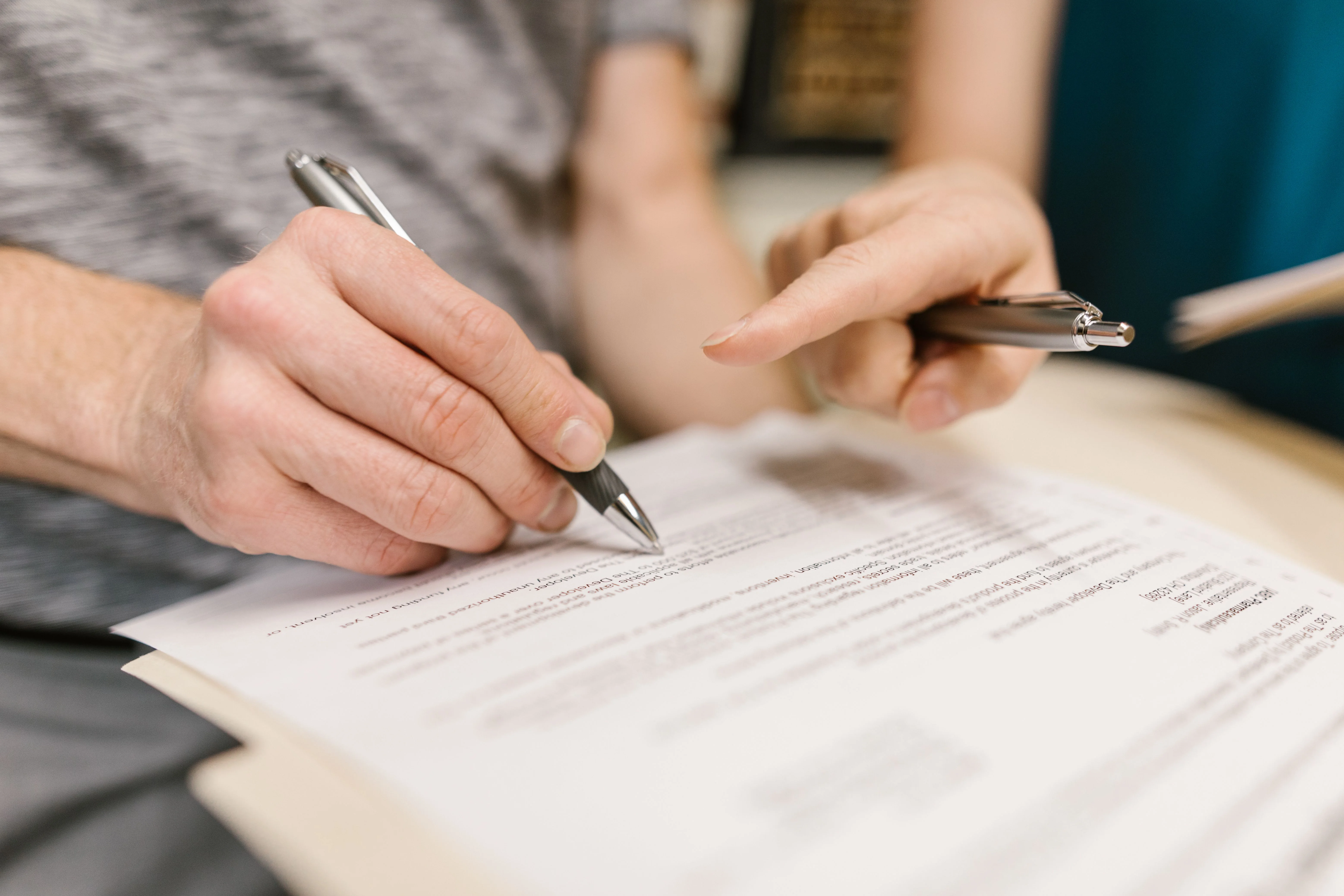 Legal professional reviewing a contract with a client